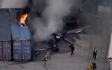 In this still image provided by KABC-TV shows first responders work the scene after a helicopter crashed near a bus crash in Chatsworth, a neighborhood in Los Angeles, September 15, 2026. (KABC-TV via AP)