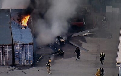 In this still image provided by KABC-TV shows first responders work the scene after a helicopter crashed near a bus crash in Chatsworth, a neighborhood in Los Angeles, September 15, 2026. (KABC-TV via AP)