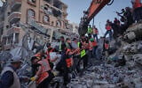 Palestinian civil defense crews carry a body from the rubble of a collapsed building that housed displaced Palestinians and was heavily damaged during the Israel-Hamas war, in Gaza City, September 16, 2026. (AP Photo/Jehad Alshrafi)