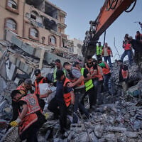 Palestinian civil defense crews carry a body from the rubble of a collapsed building that housed displaced Palestinians and was heavily damaged during the Israel-Hamas war, in Gaza City, September 16, 2026. (AP Photo/Jehad Alshrafi)