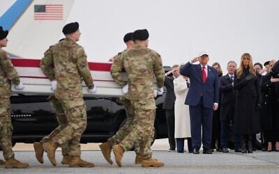 An Army carry team moves a flag-draped transfer case with the remains of Sgt. Declan Coady, 20, of West Des Moines, Iowa, past US President Donald Trump and first lady Melania Trump during a casualty return, March 7, 2026, at Dover Air Force Base, Delaware. (AP Photo/Mark Schiefelbein) An Army carry team moves a flag-draped transfer case with the remains of Sgt. Declan Coady, 20, of West Des Moines, Iowa, past US President Donald Trump and first lady Melania Trump during a casualty return, March 7, 2026, at Dover Air Force Base, Delaware. (AP Photo/Mark Schiefelbein)