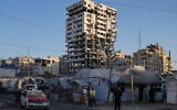 Tents sheltering displaced Palestinians and a market surround a building heavily damaged during the Israel-Hamas war in Gaza City, September 17, 2026. (AP/Jehad Alshrafi)