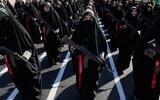 Women affiliated with Iran’s Revolutionary Guards carry rifles as they stand during the state-organized 'Janfada,' or 'Sacrifice for Iran,' military-style parade in Tehran, Iran, September 18, 2026. (AP Photo/Vahid Salemi)