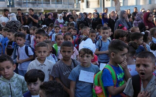 Palestinian children line up on the first day of the new academic year at an UN-run school in Nuseirat, central Gaza Strip, September 19, 2026. (AP Photo/Jehad Alshrafi) Palestinian children line up on the first day of the new academic year at an UN-run school in Nuseirat, central Gaza Strip, September 19, 2026. (AP Photo/Jehad Alshrafi)