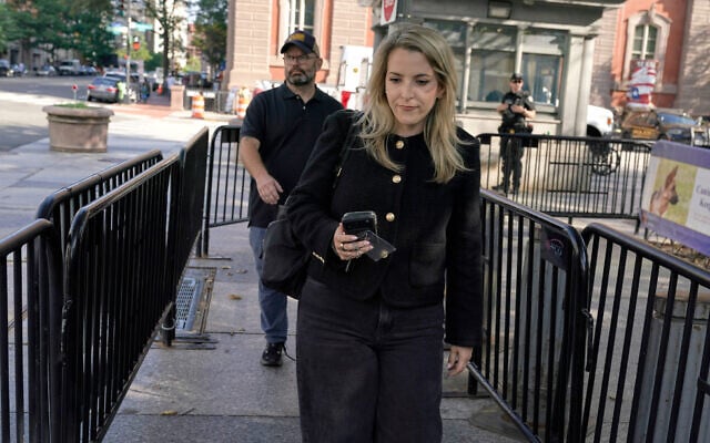 CNN Senior White House Reporter Betsy Klein, carrying an empty credential holder after having her credential revoked following US President Donald Trump’s ban on CNN, MS NOW and Politico, walks near the White House, September 19, 2026, in Washington. (AP Photo/Jose Luis Magana)