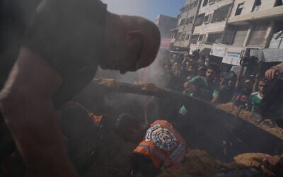 Hamas-run civil defense workers operate on a destroyed vehicle following an Israeli airstrike in Gaza city, September 19, 2026. (AP Photo/Jehad Alshrafi) Hamas-run civil defense workers operate on a destroyed vehicle following an Israeli airstrike in Gaza city, September 19, 2026. (AP Photo/Jehad Alshrafi)