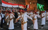 Supporters of Yemen’s Houthi rebels dance during a rally to mark the 12th anniversary of the fall of Sanaa to the Houthis, in Sanaa, Yemen, September 20, 2026. (AP Photo/Osamah Abdulrahman)