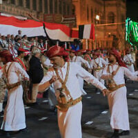 Supporters of Yemen’s Houthi rebels dance during a rally to mark the 12th anniversary of the fall of Sanaa to the Houthis, in Sanaa, Yemen, September 20, 2026. (AP Photo/Osamah Abdulrahman)