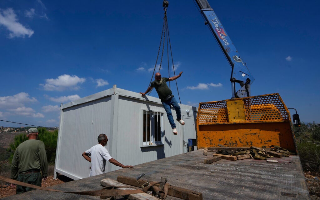Workers set up a prefabricated unit to provide housing for families whose homes have been destroyed in the fighting between Hezbollah and Israel, in Zawtar al-Gharbieh, southern Lebanon, September 21, 2026. (AP Photo/Mohammed Zaatari) Workers set up a prefabricated unit to provide housing for families whose homes have been destroyed in the fighting between Hezbollah and Israel, in Zawtar al-Gharbieh, southern Lebanon, September 21, 2026. (AP Photo/Mohammed Zaatari)