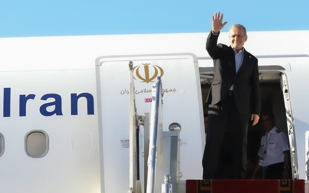 In this photo released by the Iranian Presidency Office, President Masoud Pezeshkian waves to media and officials as he boards his plane while leaving Mehrabad airport for New York to attend the UN General Assembly, in Tehran, Iran, September 22, 2026. (Iranian Presidency Office via AP) In this photo released by the Iranian Presidency Office, President Masoud Pezeshkian waves to media and officials as he boards his plane while leaving Mehrabad airport for New York to attend the UN General Assembly, in Tehran, Iran, September 22, 2026. (Iranian Presidency Office via AP)