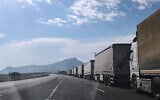 Trucks wait on the road leading to the Gurbulak border crossing on the Turkish-Iranian border in Agri province, eastern Turkey, September 22, 2026. (Serra Yedikardes/AP)