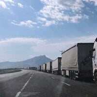 Trucks wait on the road leading to the Gurbulak border crossing on the Turkish-Iranian border in Agri province, eastern Turkey, September 22, 2026. (Serra Yedikardes/AP)