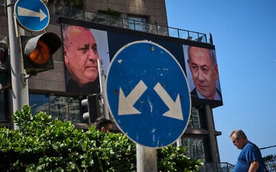 A man walks past a television channel advertisement featuring Prime Minister Benjamin Netanyahu, right, and his main rival, opposition candidate Gadi Eisenkot, ahead of Israel’s general election, in Ramat Gan, September 23, 2026. (AP Photo/Oded Balilty) A man walks past a television channel advertisement featuring Prime Minister Benjamin Netanyahu, right, and his main rival, opposition candidate Gadi Eisenkot, ahead of Israel’s general election, in Ramat Gan, September 23, 2026. (AP Photo/Oded Balilty)