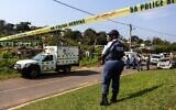 Illustrative: A police officer is seen at a scene of a mass shooting at a house party in KwaMakhutha township south of the city Durban, South Africa, September 23, 2026. (AP Photo)