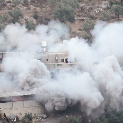 Smoke rises as Israeli forces demolish the home of Palestinian prisoner Dawas Hassouna, who is accused of killing an Israeli settler, in the West Bank village of Beit Amarin, September 24, 2026. (AP Photo/Majdi Mohammed) Smoke rises as Israeli forces demolish the home of Palestinian prisoner Dawas Hassouna, who is accused of killing an Israeli settler, in the West Bank village of Beit Amarin, September 24, 2026. (AP Photo/Majdi Mohammed)
