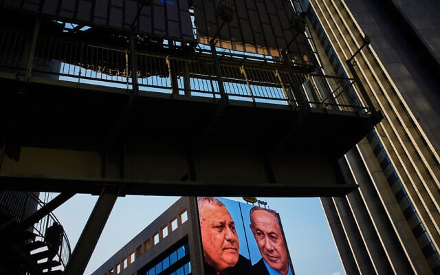 A television channel advertisement featuring Prime Minister Benjamin Netanyahu, right, and his main election rival Gadi Eisenkot ahead of the Knesset election, in Ramat Gan, September 24, 2026. (AP Photo/Oded Balilty)