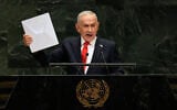 Prime Minister Benjamin Netanyahu holds up a Starlink satellite internet terminal as he speaks during the 81st session of the United Nations General Assembly at United Nations headquarters, September 24, 2026. (AP Photo/Seth Wenig)
