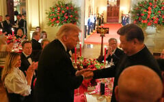 US President Donald Trump shakes hands with China’s President Xi Jinping in the East Room of the White House during a State Dinner, September 24, 2026, in Washington. (AP Photo/Alex Brandon)