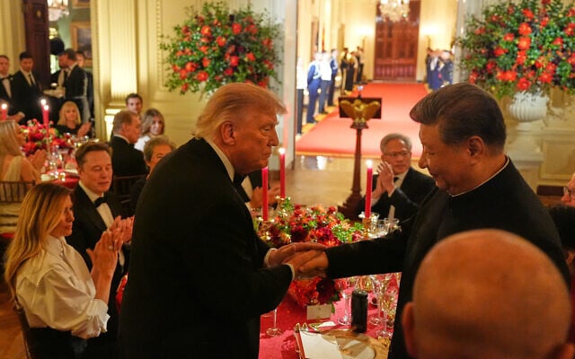 US President Donald Trump shakes hands with China’s President Xi Jinping in the East Room of the White House during a State Dinner, September 24, 2026, in Washington. (AP Photo/Alex Brandon)