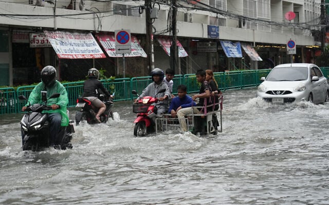 The streets are flooded after heavy rain in Bangkok, Thailand, September 26, 2026. (AP Photo/Sakchai Lalit)
