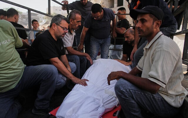 Mourners carry the body of Shadi Abu Hasira, who was killed in an Israeli strike, during his funeral in Gaza City, September 28, 2026. (AP Photo/Jehad Alshrafi)