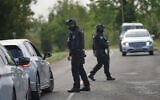 Police guard a road leading to RAF Fairford, in Fairford, England, a day after British counterterrorism police were probing “a major” incident near the base, September 28, 2026. (AP Photo/Alastair Grant)