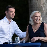 Far-right party National Rally president Jordan Bardella and far-right leader Marine Le Pen attend a rally in Lievin, northern France, on July 4, 2026. (AP Photo/Jean-Francois Badias)