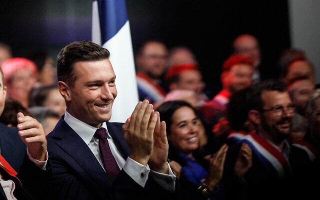 French far-right politician Jordan Bardella applauds as National Rally leader Marine Le Pen (not in picture) speaks in Henin-Beaumont, northern France, on September 13, 2026. (AP/Jean-Francois Badias) French far-right politician Jordan Bardella applauds as National Rally leader Marine Le Pen (not in picture) speaks in Henin-Beaumont, northern France, on September 13, 2026. (AP/Jean-Francois Badias)
