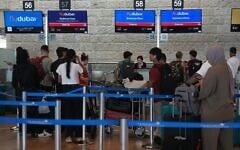 Passengers wait in line to check in their luggage with flydubai at Ben Gurion International Airport, near Tel Aviv, Israel, September 30, 2026. (AP Photo/Ariel Schalit)