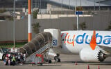 Passengers embark on a FlyDubai aircraft at Ben Gurion International Airport, near Tel Aviv, Israel, September 30, 2026. (AP Photo/Ariel Schalit)