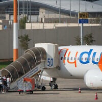 Passengers embark on a FlyDubai aircraft at Ben Gurion International Airport, near Tel Aviv, Israel, September 30, 2026. (AP Photo/Ariel Schalit)