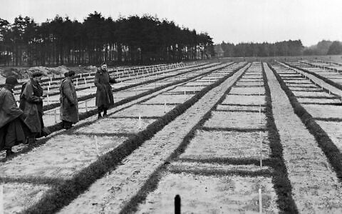 American soldiers of the US 9th army are looking over the vast expanse of grave plots at German Stalag 326-6k in Germany on April 17, 1945, where 30,000 Russian prisoners of war are buried. (Fred Ramage/AP)