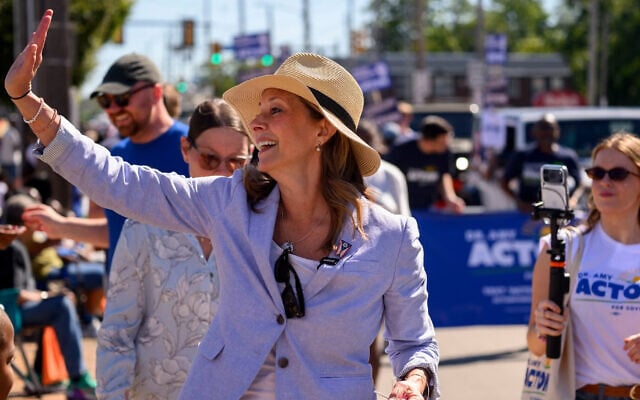 Dr. Amy Acton, the Democratic candidate for governor of Ohio, greets constituents along the parade route of the 54th Annual CDC Parade on September 7, 2026 in Cleveland, Ohio.  (Jeff Swensen/Getty Images via JTA)