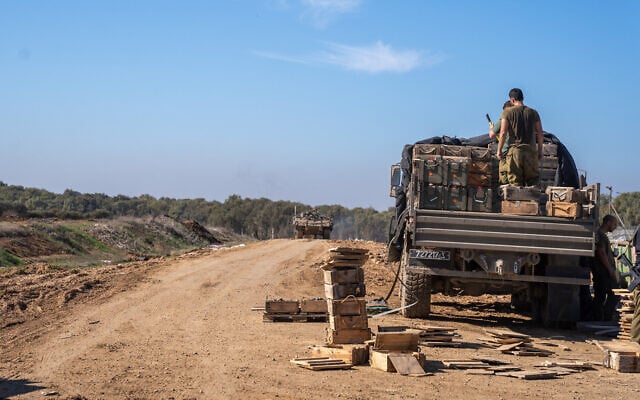 IDF troops are seen outside the Paga military post on the border with the Gaza Strip, December 15, 2023. (Emanuel Fabian/Times of Israel)