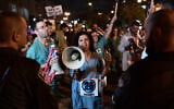 Illustrative: Medical interns demonstrate for better work conditions in Tel Aviv, on July 30, 2022. (Tomer Neuberg/Flash90)