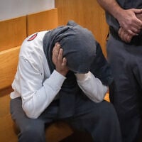 Dennis Mokin, accused of fatally shooting Diar Umari during a road rage clash, is brought for a court hearing at the Nazareth Magistrate’s Court on May 7, 2023. (Fadi Amun/Flash90)