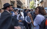 Ultra-Orthodox protesters demonstrate against Cafe Basimta operating on Shabbat and clash with police, while secular protesters hold a counter-demonstration in support of the cafe in central Jerusalem, August 15, 2026. (Oren Ben Hakoon/Flash90)
