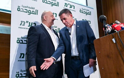 Yoav Segalovitz, right, reaches for the hand of Ra'am leader Mansour Abbas at a press conference in Nazareth on August 31, 2026. (Michael Giladi/FLASH90) Yoav Segalovitz, right, reaches for the hand of Ra'am leader Mansour Abbas at a press conference in Nazareth on August 31, 2026. (Michael Giladi/FLASH90)