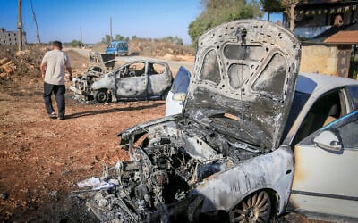 Palestinians inspect burned-out cars after an attack by settlers, where they also spray-painted Hebrew graffiti on the walls of a house in Beita, south of Nablus in the West Bank, September 2, 2026. (Nasser Ishtayeh/Flash90) Palestinians inspect burned-out cars after an attack by settlers, where they also spray-painted Hebrew graffiti on the walls of a house in Beita, south of Nablus in the West Bank, September 2, 2026. (Nasser Ishtayeh/Flash90)