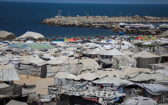 Tents housing displaced Palestinians are seen among homes destroyed during the recent war between Israel and Hamas in Gaza City, central Gaza Strip, September 3, 2026. (Ali Hassan/Flash90)
