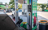 A fuel pump nozzle inserted into a car at a Dor Alon gas station in central Israel, September 4, 2026. (Nati Shohat/Flash90)