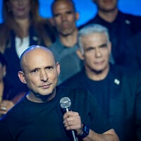 Together party chairman Naftali Bennett (front), together with Opposition Leader Yair Lapid and party members (right), present the party’s candidate list ahead of the upcoming general elections in Tel Aviv, September 6, 2026. (Flash90)