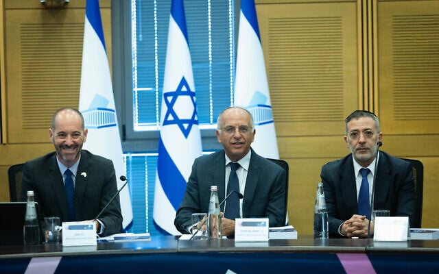 Chair of the Central Elections Committee, Supreme Court Justice Noam Sohlberg, Acting Director-General of the Central Elections Committee, Attorney Din Livne, and committee members attend the registration of political party lists ahead of the upcoming election at the Knesset in Jerusalem, September 7, 2026. (Yonatan Sindel/Flash90)