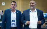 Ra’am party chairman Mansour Abbas (left), together with party member Yoav Segalovitz, arrives to submit the party list to the Central Elections Committee ahead of the upcoming Israeli election at the Knesset, in Jerusalem, September 7, 2026. (Yonatan Sindel/Flash90)