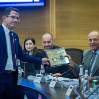 Chairman of the Central Elections Committee, Supreme Court Justice Noam Sohlberg (right), attends the registration of political parties ahead of the election at the Knesset in Jerusalem, September 7, 2026. (Yonatan Sindel/Flash90)