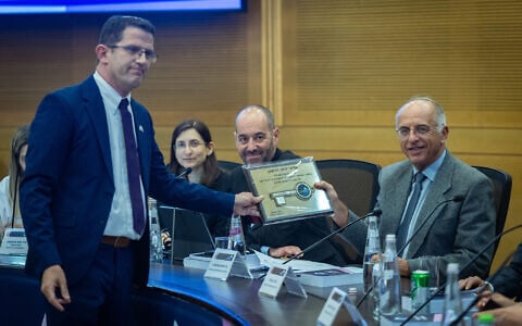 Chairman of the Central Elections Committee, Supreme Court Justice Noam Sohlberg (right), attends the registration of political parties ahead of the election at the Knesset in Jerusalem, September 7, 2026. (Yonatan Sindel/Flash90)