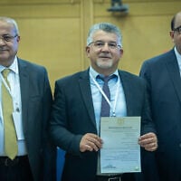 Joint List members Ta'al leader MK Ahmad Tibi (Left), Hadash leader Yousef Jabareen (center), and Balad leader Sami Abu Shehadeh (right) submit their party’s candidate list to the Central Elections Committee ahead of the upcoming election, at the Knesset, Jerusalem, September 8, 2026. (Yonatan Sindel/Flash90)
