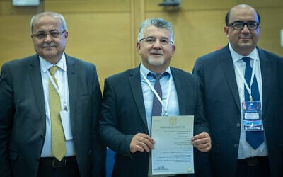 Joint List members Ta'al leader MK Ahmad Tibi (Left), Hadash leader Yousef Jabareen (center), and Balad leader Sami Abu Shehadeh (right) submit their party’s candidate list to the Central Elections Committee ahead of the upcoming election, at the Knesset, Jerusalem, September 8, 2026. (Yonatan Sindel/Flash90)