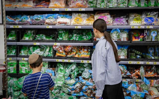 People shop at a supermarket in Jerusalem, a day before the start of Rosh Hashanah, the Jewish New Year, September 10, 2026. (Rachel Alroey/Flash90)