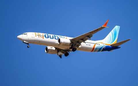 A flydubai passenger plane flies over Ben Gurion International Airport, central Israel, September 9, 2026. (Yossi Aloni/Flash90)